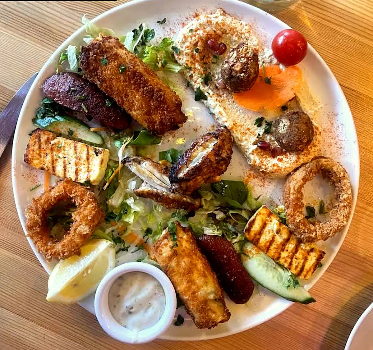 Turkish hot meze platter with halloumi, sucuk, falafel, calamari and sigara boregi