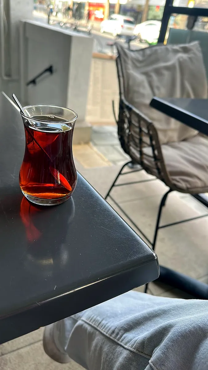Turkish tea in a tulip glass by the window